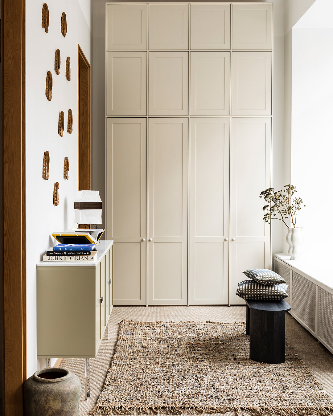 A.S.Helsingö Ensiö built-in wardrobe in linen brown colour with candy handles in spotty white