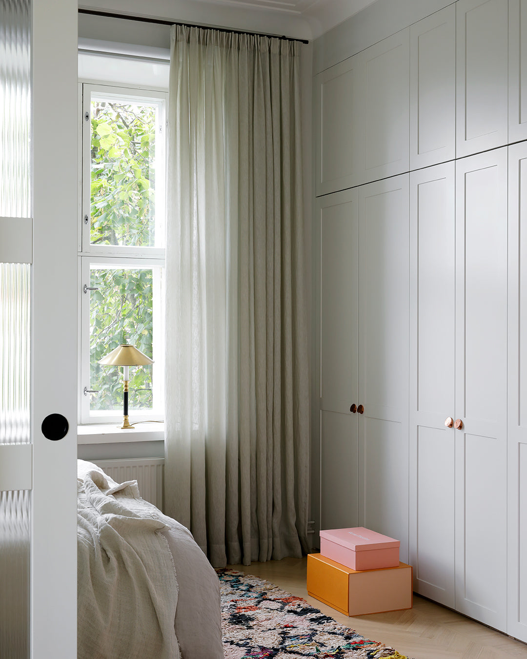 A.S.Helsingö Ensiö wardrobe in feather grey colour with copper Bagel handles 